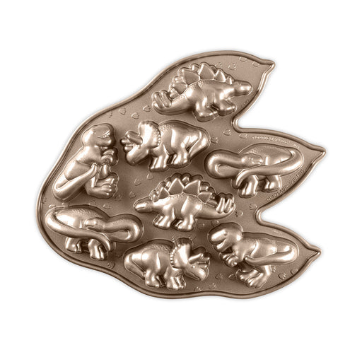 Nordic Ware | Dinosaur Cakelet Pan featuring dinosaur shapes, ideal for baking themed cakes. Crafted from cast aluminum with nonstick coating for easy release.