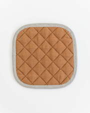 MagicLinen linen pot-holder, square-shaped with quilted detailing, ideal for heat protection in kitchens.