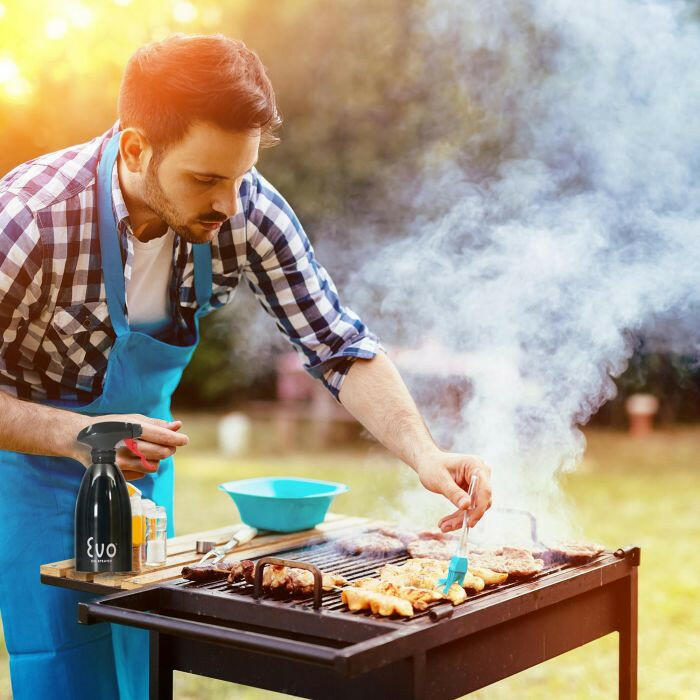 Close-up of the Evo Stainless Steel Oil Sprayer, showcasing its sleek design and ergonomic trigger, ideal for precise oil distribution in cooking.