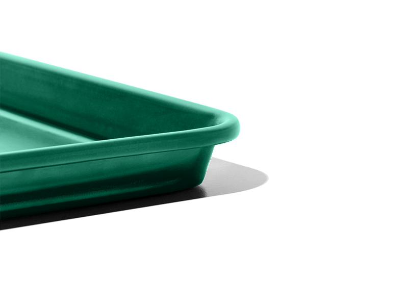Great Jones | Holy Sheet - Blueberry: Close-up of a versatile half-sized sheet pan with a custom nonstick ceramic coating, ideal for easy kitchen cleanup.