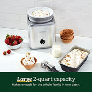 Cuisinart | Pure Indulgence 2 Quart Frozen Yogurt-Sorbet & Ice Cream Maker shown with waffle bowls, strawberries, and milk pitcher, emphasizing its dessert-making capabilities.