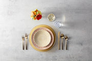 Fortessa | Jupiter Amber 13 Charger in a vintage-inspired table setting with glassware and silverware, showcasing elegant serveware ideal for stylish dining experiences.