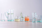 Moroccan Cone Glassware Small - Clear - Set of 6, hand-blown from recycled bottles with visible bubbles, features cone shapes ideal for drinks or small vases.