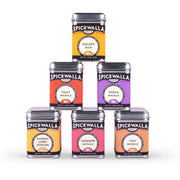 Spicewalla | Chai Pani Masala Collection 6 Pack Gift Set, featuring six spice blends in metal tins, stacked in a pyramid, for authentic Indian cooking.