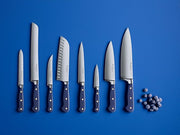 Wüsthof Classic 6 Utility Knife Wild Blueberry, shown alongside blue balls, highlighting its sleek blade and functionality for versatile kitchen use.
