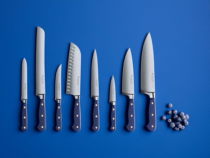 Wüsthof Classic 8 Chef's Knife Wild Blueberry displayed among other knives, highlighting its sleek design and precision blade, ideal for culinary enthusiasts.