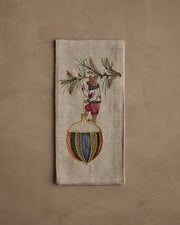 Coral & Tusk - Deck the Halls Bear Tea Towel features a brown bear in festive attire, embroidered on natural linen, perfect for holiday kitchen decor.
