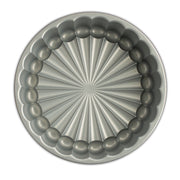 Nordic Ware | Charlotte Cake Pan, featuring a circular design, ideal for crafting elegant French desserts effortlessly with its 6-cup capacity.