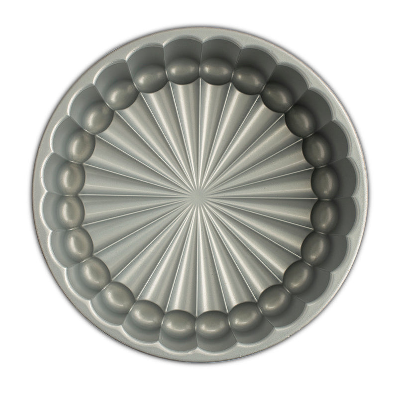 Nordic Ware | Charlotte Cake Pan, featuring a circular design, ideal for crafting elegant French desserts effortlessly with its 6-cup capacity.
