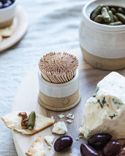 Farmhouse Pottery - Countryman Toothpick Holder on a cheese platter with blue cheese, crackers, and olives, perfect for stylish serving at gatherings.