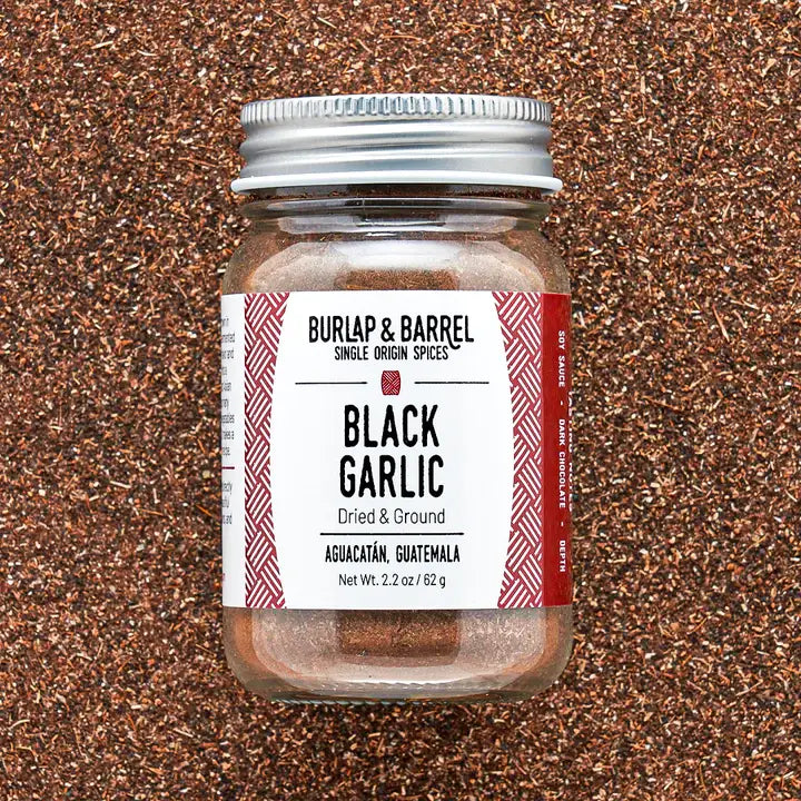 Burlap & Barrel - Black Garlic - Single Origin Spice & Seasoning in a glass jar from Aguacatán, Guatemala, showing its dark, finely ground garlic powder content.
