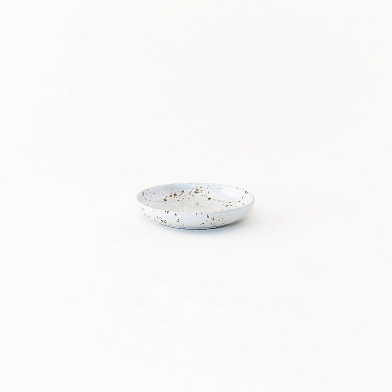 Sarah Kersten - Olive Dish: Basin Collection: Fig, a small, versatile white plate with brown specks, ideal for serving olives or bread, from Athens Cooks.