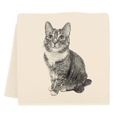 Eric & Christopher - Cat Tea Towel - Izzy features a cream-colored, folded card with a black-and-white illustration of a tabby cat, winner of a 2022 photo contest.