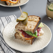 Beth's Farm Kitchen's Cranberry Horseradish Relish adds zing to a turkey sandwich on rustic sourdough, perfect for cheese boards or game meats.