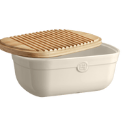 Emile Henry | Bread Box, Burgundy: Off-white ceramic storage crock with a slotted bamboo lid that doubles as a crumb-catching cutting board. Ideal for artisan bread storage.