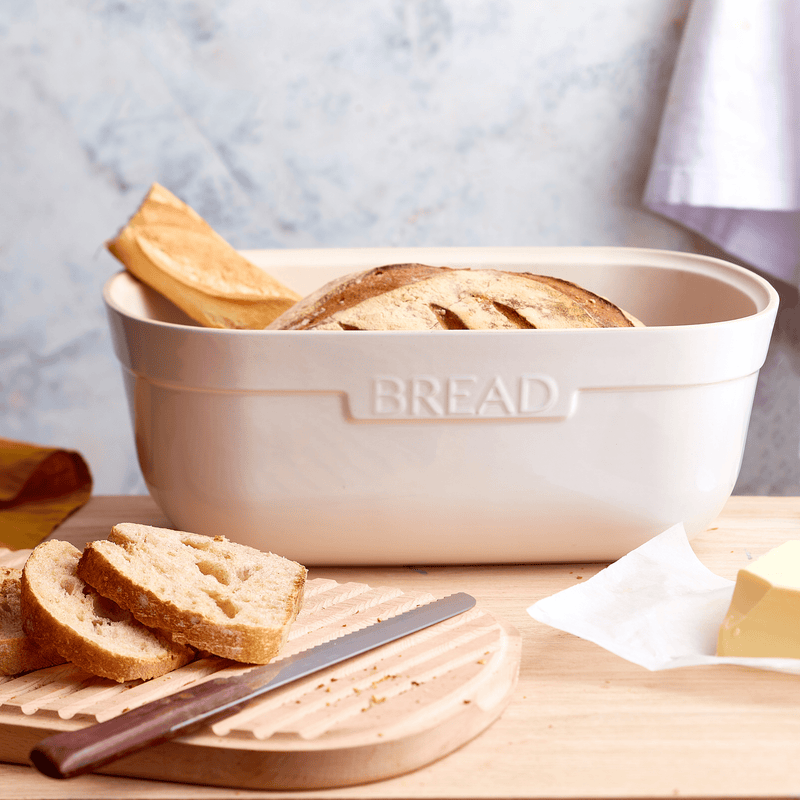 Emile Henry Bread Box Clay — styled on a kitchen counter with artisan loaf