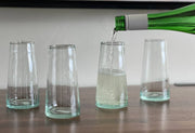 Moroccan Cone Champagne Glasses - Set of 6, handblown from recycled wine bottles, showcasing unique shapes and bubbles, packaged in traditional Moroccan gift packaging.