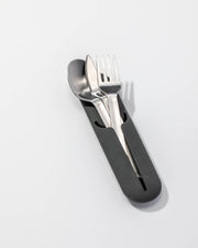 W&P - Stainless Steel Utensils Set in Silicone Carry Case: Terrazzo Charcoal showcasing a fork, knife, and spoon in a compact, tidy silicone holder.