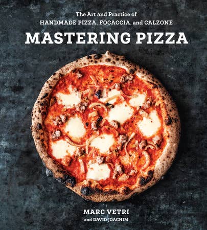 Cover of Mastering Pizza by Marc Vetri and David Joachim, featuring a wood-fired pizza. The cookbook guides home cooks in crafting perfect, artisanal pizzas.