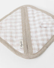 MagicLinen linen pot-holder with quilted detailing and hanging loop on a white surface, ideal for kitchen heat protection.