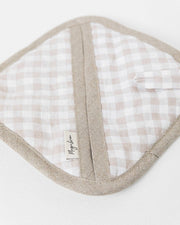 MagicLinen linen pot-holder with quilted detailing and loop for hanging, displayed on a white surface, ideal for kitchen use and heat protection.