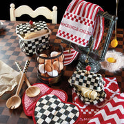 MacKenzie-Childs | Courtly Check Butter Box atop a butcher-block table with checkered ceramics and branded accessories, showcasing a whimsical, curated kitchen display.