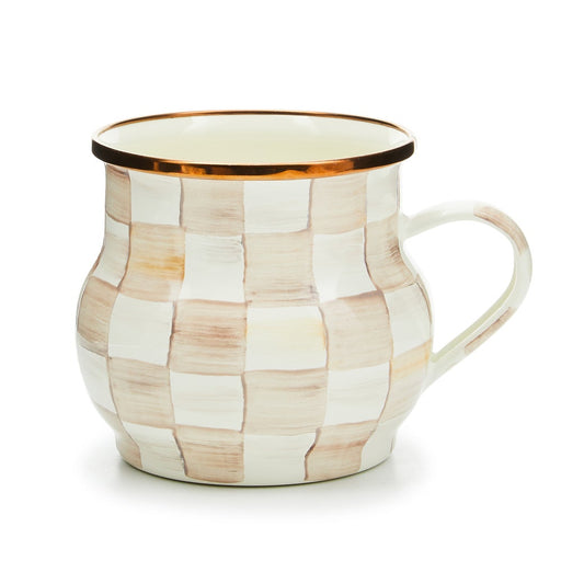 MacKenzie Childs | Mocha Check Mug: Artisanal ceramic mug with hand-painted off-white and beige checks, flared shape, single handle, and metallic rim accent, perfect for hot beverages.