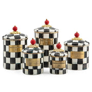 MacKenzie Childs | Courtly Check Small Canister: Set of five hand-painted ceramic canisters with black-and-white checks, gold trim, and red finial lids, ideal for versatile kitchen storage.