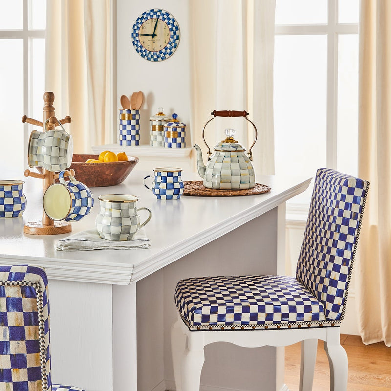 Sterling Check Medium Canister by MacKenzie Childs on a sunlit kitchen island, surrounded by matching checkerboard tea set and decor.