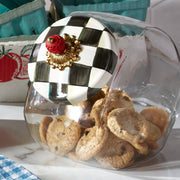 MacKenzie Childs | Cookie Jar with Courtly Check Lid: glass jar tipped over, filled with cookies; lid features hand-painted checks and a decorative finial.