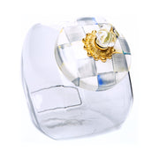 MacKenzie Childs | Cookie Jar with Sterling Check Lid features a clear glass body and a hand-painted, check-patterned lid with a gold-tone base and glass knob.