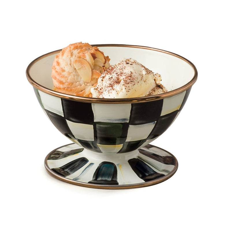 MacKenzie-Childs | Courtly Check Ice Cream Dish with vanilla ice cream and macaroon, featuring a black-and-white checkered pattern and gold rim, showcasing elegant dessert presentation.