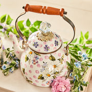 MacKenzie Childs | Wildflowers Pink Tea Kettle, 2 QT., cream with floral motifs, brass-tone accents, glass knob, wooden handle, surrounded by fresh blooms, ideal for Athens Cooks.