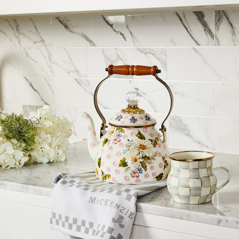 MacKenzie Childs | Wildflowers Pink Tea Kettle, 2 QT., with floral design, wooden handle, and crystal-style knob, displayed on a countertop with a matching mug and towel.