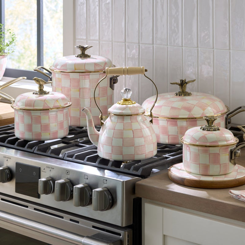MacKenzie Childs | Rosy Check Tea Kettle, 2 QT on a stovetop, surrounded by matching cookware, showcasing pink-and-white checks and brass accents, embodies Athens Cooks' curated style.