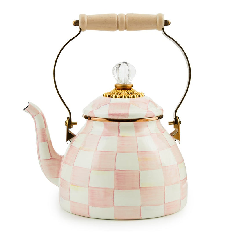 MacKenzie Childs | Rosy Check Tea Kettle, 2 QT features a pink-and-white checkerboard ceramic design, gold-tone lid band, glass knob, and wooden-handled metal curve.