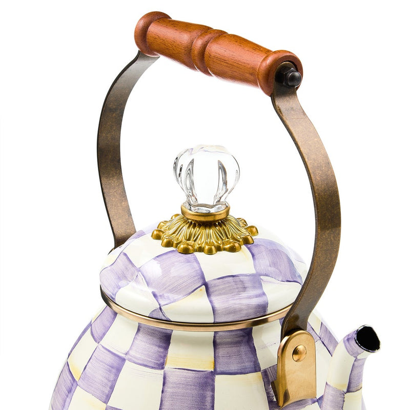 MacKenzie-Childs | Violet Check Tea Kettle, 2 Qt features a hand-painted purple check pattern, gold-tone accents, and a wooden-handled arch, perfect for stylish stovetop use.