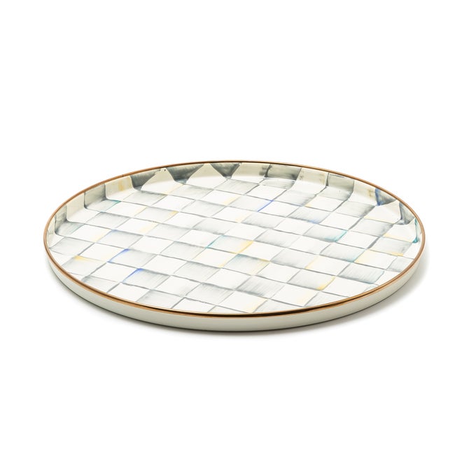 MacKenzie-Childs Sterling Check Round Tray with hand-painted checkered pattern in soft hues, featuring a bronzed rim, ideal for serving or display.
