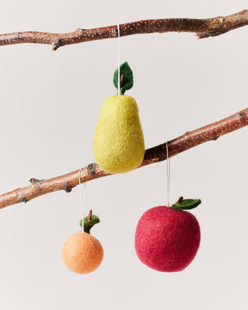 Farmhouse Pottery - Felted Fruit Ornament: Apple, displayed hanging on a branch with felted pear and clementine, handcrafted in Nepal from 100% wool.