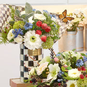 MacKenzie Childs | Courtly Check Utensil Holder showcased with vibrant floral arrangement, featuring hand-painted checks, ideal for kitchen or craft storage.