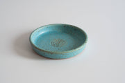 RachaelPots - Garlic Scraper: Light Blue, a shallow, speckled turquoise ceramic dish for pureeing garlic, ginger, and onions, handmade in Brooklyn, ideal for cooking enthusiasts.
