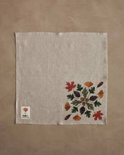 Coral & Tusk - Pressed Leaves Dinner Napkin, featuring embroidered autumn leaves and acorns, perfect for seasonal dining. Measures 20 × 20, ideal for fall table settings.