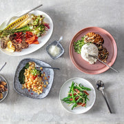 Zwiesel Fortessa | Arezzo Flatware Serving Set, Brushed, elegantly complements a vibrant vegetable spread, enhancing tabletop aesthetics with its sleek, durable 18/10 stainless steel design.