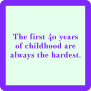 Drinks on Me - COASTER featuring the saying, “The first 40 years of childhood are always the hardest,” adding humor to any home bar or party setting.