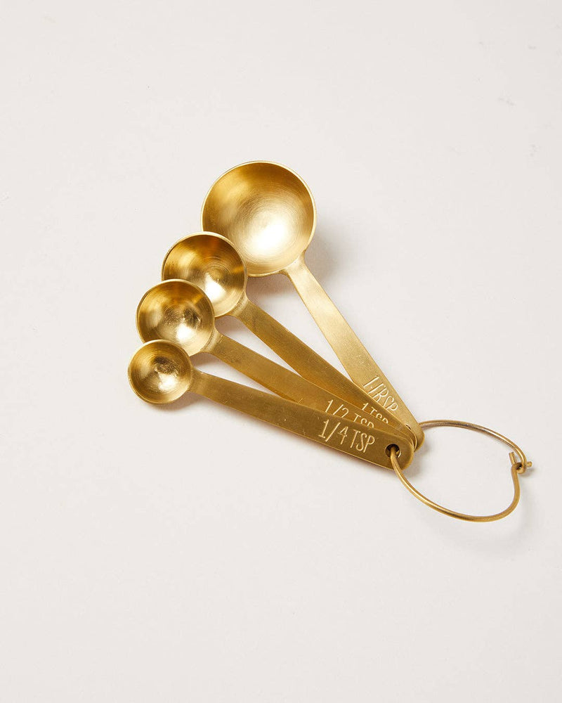 Farmhouse Pottery - Stowe Measuring Spoons: Brushed Gold / Single, a set of four gold-toned stainless steel measuring spoons on a ring, showcasing durability and precision.