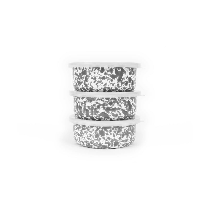 Crow Canyon Home - Splatter Enamelware 3-pc Storage Bowl Set features three round bowls with white lids and a black-and-white speckled pattern, ideal for entertaining.