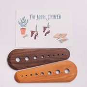 Collin Garrity - Herb Stripper: Walnut, featuring two wooden boards with graduated holes for stripping herb leaves, accompanied by an instruction card with illustrated usage steps.