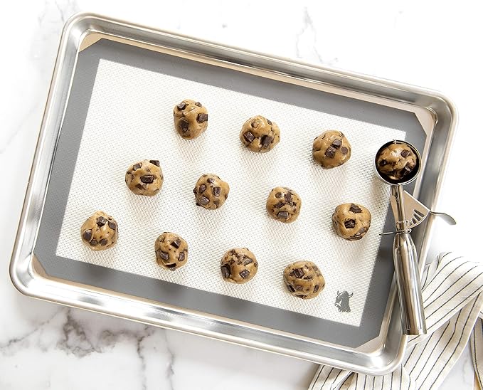 Nordic Ware | Small Cookie Dropper on baking sheet, showcasing uniform cookie dough portions for consistent baking results. Perfect tool for precision in baking.