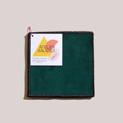 ATELIER SAUCIER - Bird of Paradise Cocktail Napkin in lush emerald green, with black glittered edge, displayed with hang tag; 5 x 5, set of four.