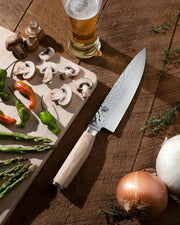 Shun | Premier Blonde Starter Set, 3 Pc features prominently, showcasing the elegant chef's knife on a rustic cutting board amid fresh ingredients.
